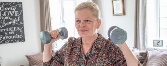 Elderly lady lifting weights