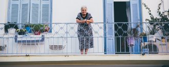 Elderly lady on her balcony