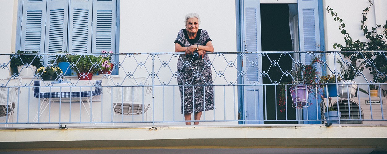 Elderly lady on her balcony