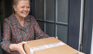 Elderly lady receiving a package