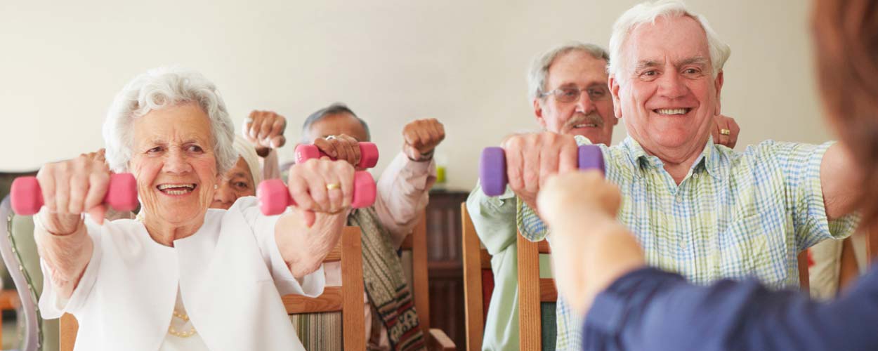 Group of elderly people lifting weights
