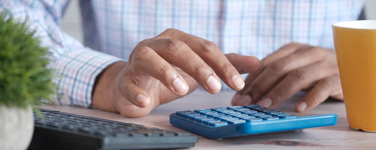man calculating inheritance tax